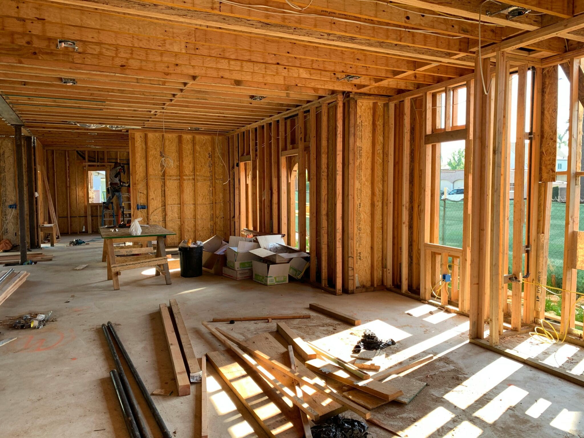 A room with many wooden planks and windows