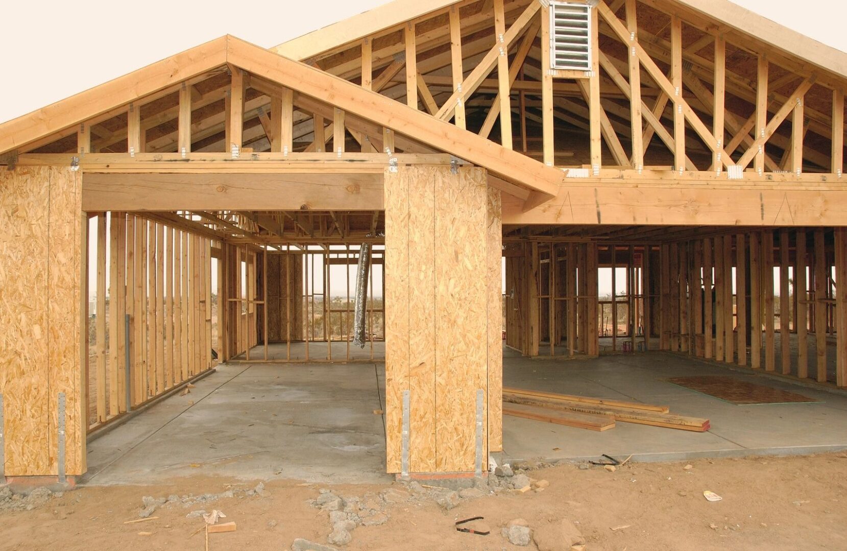 A building under construction with wood framing.