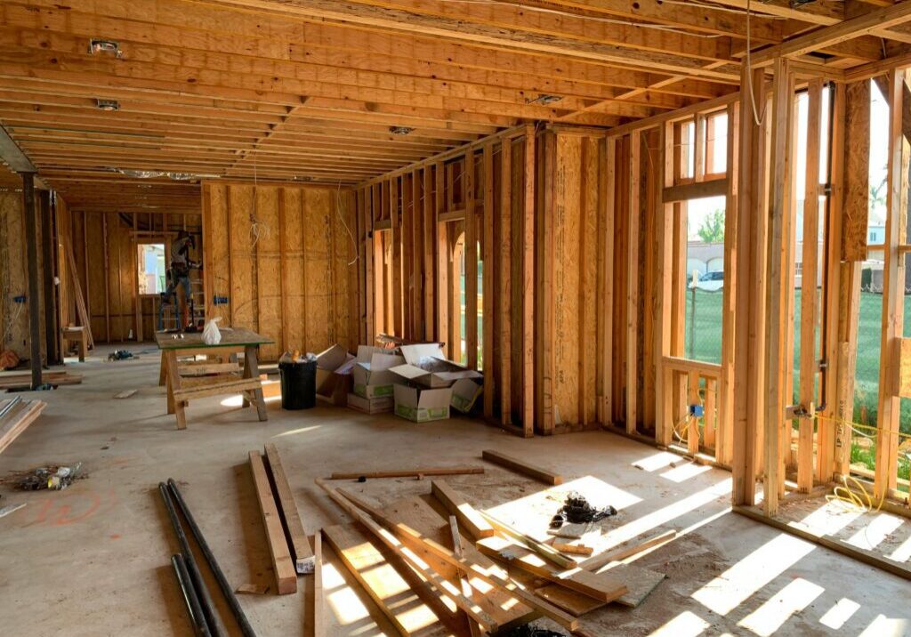 A room with many wooden planks and windows